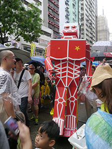 Kacey Wong's robot on the annual pro-democracy march, 1 July 2013