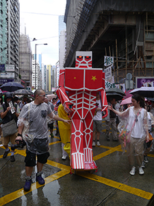 Kacey Wong's robot on the annual pro-democracy march, Hennessy Road, Wanchai, 1 July 2013