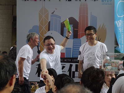 Founders of the Occupy Central movement interacting with participants on the annual pro-democracy march, 1 July 2013