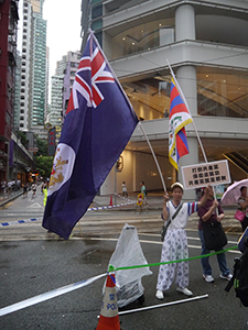 Hong Kong colonial era flag, on the annual pro-democracy march, Wanchai, 1 July 2013