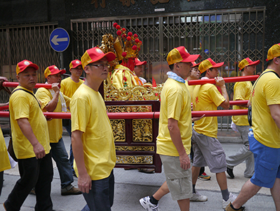 Religious figurine being carried in a procession, Ko Shing Street, Sheung Wan, 20 September 2013