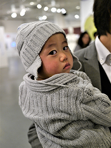 Young visitor at the opening of a memorial exhibition for Leung Ping-kwan in the basement of the Central Library, Causeway Bay, 9 January 2014