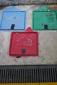 Painted drain covers, Sham Shui Po, 3 February 2014