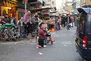 Street scene with disabled singer, Sham Shui Po, 3 February 2014