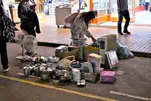 Second hand goods for sale, piled up on the street, Sham Shui Po, 3 February 2014