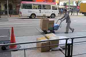 Man with a trolley, Des Voeux Road West, Sheung Wan, 24 February 2014