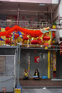 Indonesians sitting in front of a closed shop, Sham Shui Po, 3 February 2014