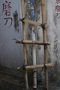 Bamboo structure and water pipe in an alleyway, Sham Shui Po, 3 February 2014