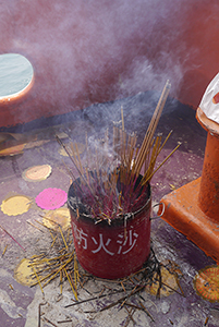 Incense sticks burning on a boat to Joss House Bay on the birthday of Tin Hau, 22 April 2014