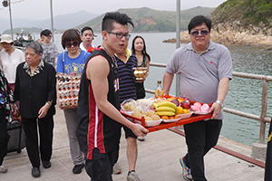 Moving offerings ashore for the birthday of Tin Hau, Joss House Bay, 22 April 2014
