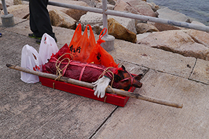 Moving offerings ashore for the birthday of Tin Hau, Joss House Bay, 22 April 2014