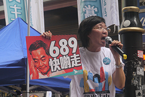 Addressing crowds on their way to the annual pro-democracy march, Great George Street, Causeway Bay, 1 July 2014