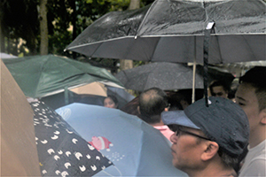 A rain shower at the annual pro-democracy march, Victoria Park, Causeway Bay, 1 July 2014