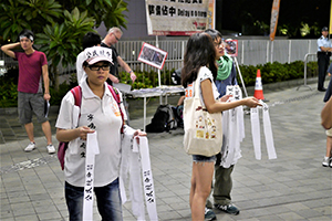 Handing out headbands before a rally at Tamar Park to launch the Occupy Central movement, 31 August 2014