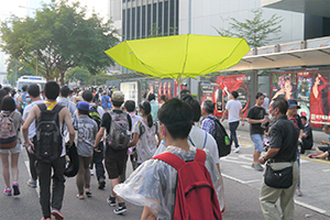 Demonstrator with a yellow umbrella, Harcourt Road, Admiralty, 28 September 2014