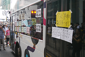 Marooned bus with posters at the Mongkok Umbrella Movement occupation site, Nathan Road, 30 September 2014