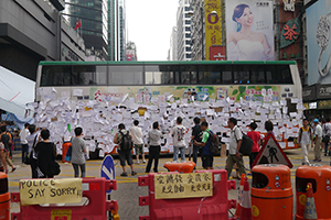 Bus barricade with posters at the Mongkok Umbrella Movement occupation site, 30 September 2014