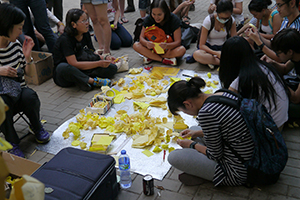 Making paper umbrellas at the Admiralty Umbrella Movement occupation site, Harcourt Road, 14 October 2014