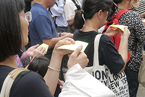 Making paper umbrellas at the Admiralty Umbrella Movement occupation site, Harcourt Road, 25 October 2014