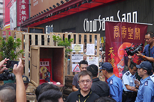 Shrine to Guan Yu installed on a barricade at the Mongkok Umbrella Movement occupation site, Nathan Road, 26 October 2014