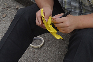 Making paper umbrellas at the Mongkok Umbrella Movement occupation site, Nathan Road, 26 October 2014