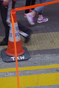 Police cone and orange tape at the Mongkok Umbrella Movement occupation site, Nathan Road, 26 October 2014