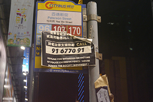 Posters on a bus stop sign at the Causeway Bay Umbrella Movement occupation site, Paterson Street, 27 October 2014