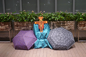 Umbrellas and a crucifixion icon at the Central Government Offices Complex, 2 October 2014
