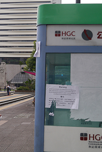 Sign on a phone booth near Statue Square, Chater Road, Central, 4 October 2014