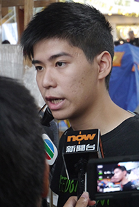 Student leader Lester Shum being interviewed at the Admiralty Umbrella Movement occupation site, Harcourt Road, 2 November 2014