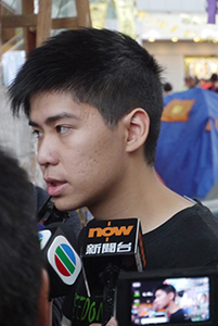 Student leader Lester Shum being interviewed at the Admiralty Umbrella Movement occupation site, Harcourt Road, 2 November 2014