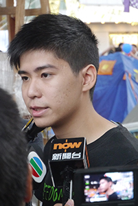 Student leader Lester Shum being interviewed at the Admiralty Umbrella Movement occupation site, Harcourt Road, 2 November 2014