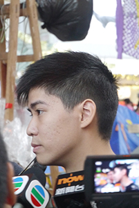 Student leader Lester Shum being interviewed at the Admiralty Umbrella Movement occupation site, Harcourt Road, 2 November 2014