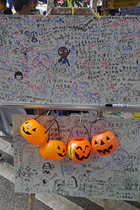 Message board with Halloween pumpkin lanterns, at the Admiralty Umbrella Movement occupation site, Harcourt Road, 9 November 2014