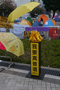Sculpture of hands holding an umbrella at the Admiralty Umbrella Movement occupation site, Harcourt Road, 15 November 2014
