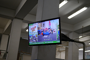 TV screen inside Cheung Chau ferry terminal showing the Umbrella Movement occupation, 22 November 2014