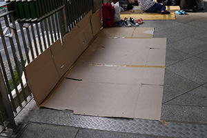 Structure made from recycled paper boxes on a footbridge, Central, 2 November 2014