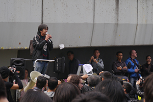 Leung Kwok-hung participating in a sit-in on the final day of the Admiralty Umbrella Movement occupation site, Harcourt Road, 11 December 2014