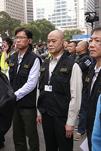 Court Bailiffs supervising clearance of barricades on the final day of the Admiralty Umbrella Movement occupation site, Connaught Road Central, 11 December 2014