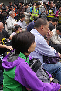 Audrey Eu, participating in a sit-in on the final day of the Admiralty Umbrella Movement occupation site, 11 December 2014