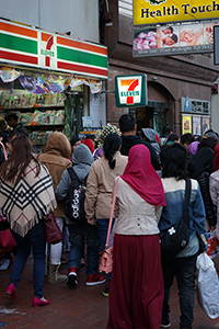 Domestic helpers outside a 7-Eleven store, Causeway Bay, 14 December 2014