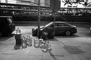 Water bottles on the street awaiting collection, Connaught Road Central, 16 December 2014