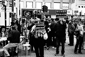 People with signs opposing Occupy Central, Sheung Wan, Hong Kong Island, 28 December 2014