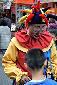 Clown at a street fair, Sheung Wan Cultural Square, 11 January 2015