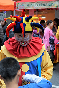 Clown at a street fair, Sheung Wan Cultural Square, 11 January 2015