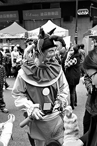 Clown at a street fair, Sheung Wan Cultural Square, 11 January 2015