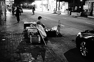 Person with belongings on the street, Queen's Road West, Sheung Wan, 27 January 2015