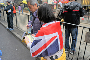 Participant draped in a British flag during a pro-democracy march from Victoria Park to Central, Hennessy Road, 1 February 2015