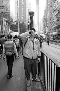 Participant with a horn, in a pro-democracy march from Victoria Park to Central, Hennessy Road, 1 February 2015