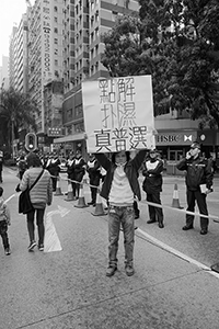 Participant with a sign in a pro-democracy march from Victoria Park to Central, Hennessy Road, 1 February 2015